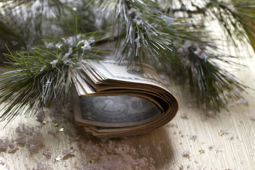 stack of dollars on the Christmas tree