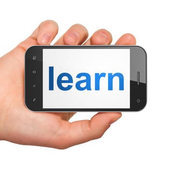 Hand holding smartphone with word learn on display. Generic mobile smart phone in hand on white background.