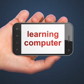 Hand holding smartphone with word learning computer on display. Generic mobile smart phone in hand on dark blue background.