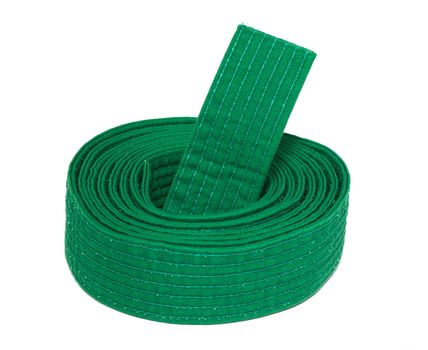 Coiled karate green belt isolated on white background