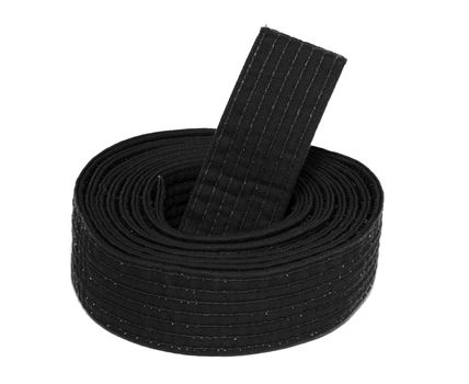 Coiled karate black belt isolated on white background