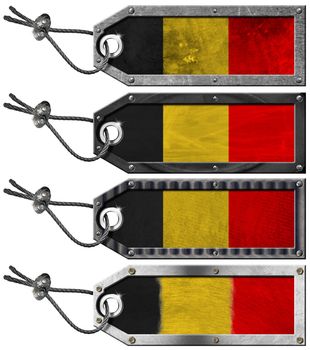 Four grunge metallic tags with belgian flags, steel cable and metal rivets
