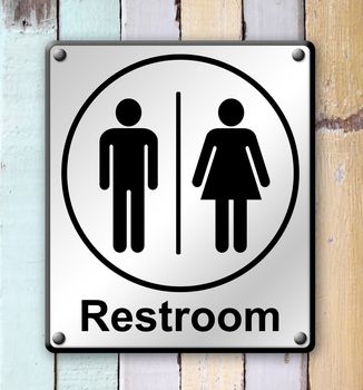 restroom sign on old colour wooden wall background