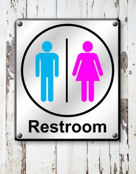 silver restroom sign on white wooden wall background