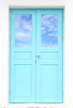 Greek style door with blue sky view