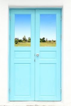 Greek style door with country field view