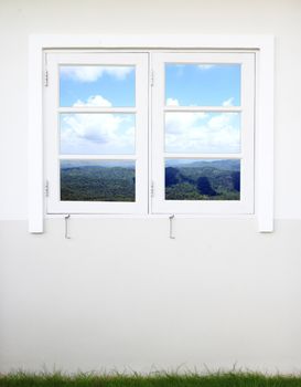 white wooden window with mountain and sky view