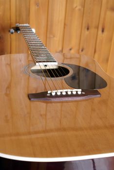 A closeup shot of an acoustic guitar.