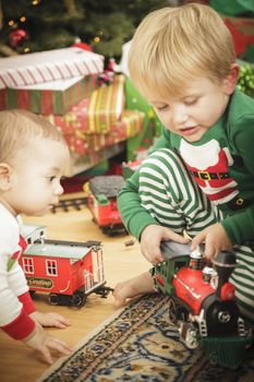 Cute Young Boy Enjoying Christmas Morning Near The Tree.