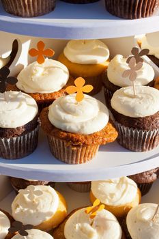 Wedding cupcakes of chocolate, vanilla, and carrotcake at a wedding reception.