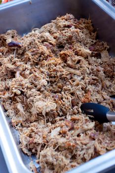 Pulled pork at a buffet table during a wedding reception.