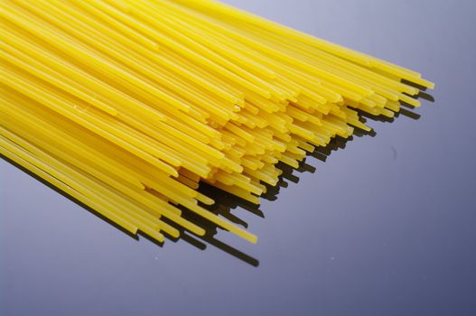 spaghetti against a black background.