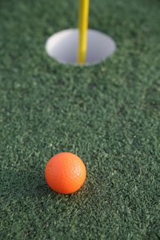 Close up of a pin and cup on a golf hole