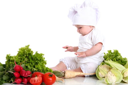 Baby cook with fresh vegetables isolated on a white