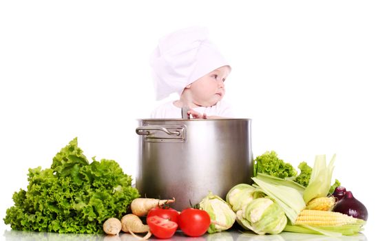 Baby cook with pan and vegetables isolated on a white