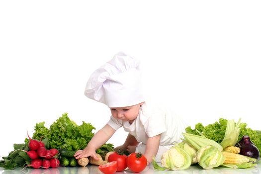 Baby cook with fresh vegetables isolated on a white