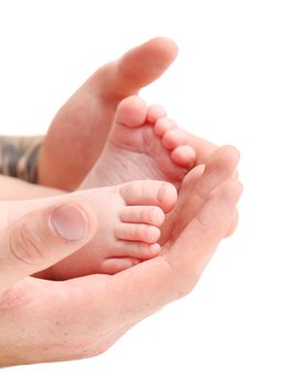 Baby`s foots in father hands isolated on a white