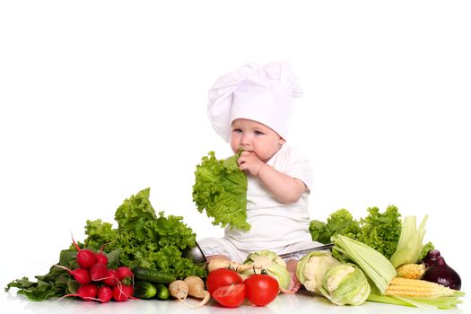 Baby cook with fresh vegetables isolated on a white