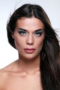 Close up of attractive woman with beautiful hair waved by wind