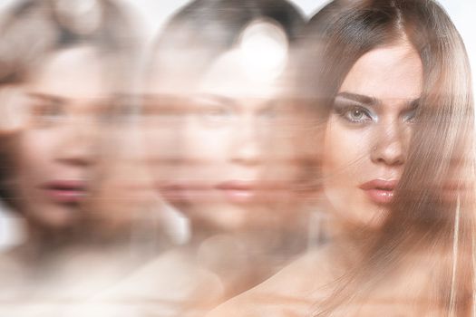 Close up of attractive woman with long hair in motion effect