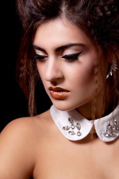 glamour elegant woman portrait with golden makeup on black