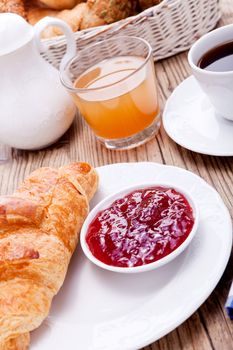 healthy french breakfast coffee croissant on wooden table