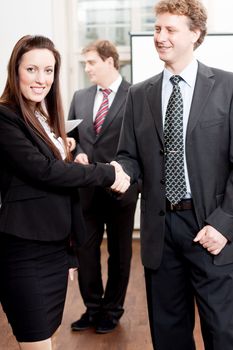business woman and man shake hands partnership contract