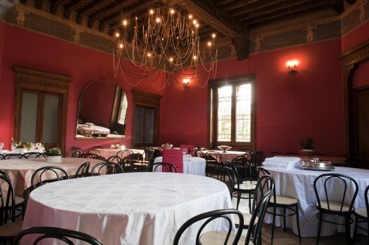 Dining room in the hall of an ancient castle.