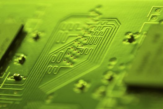 abstract macro shot of PC circuit board; focus on central part