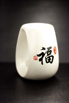 White oil burner in oriental style on a black background