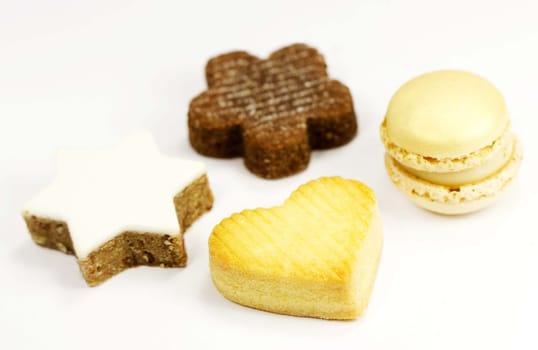 Four different cookies on a white background