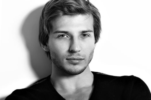 Portrait of handsome and attractive man in studio