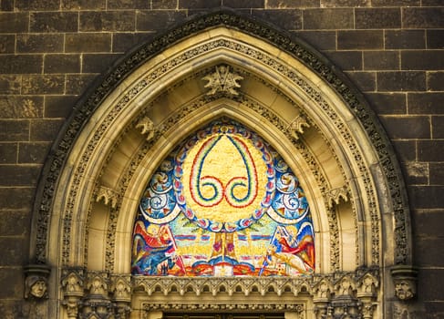 The view of a colored mosaic on an old gotic temple in Prague, Czech Republic