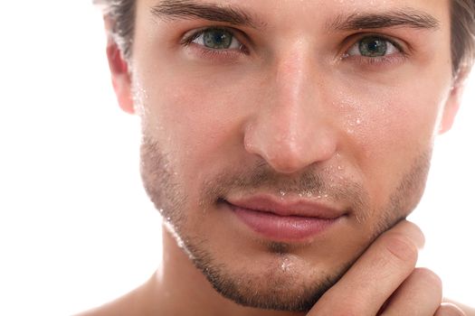 Charming and handsome man face close up over a white background