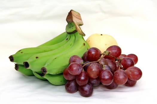 grapes and banana isolated on a white background