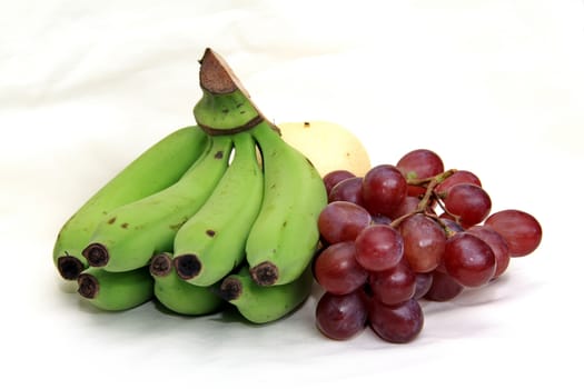 grapes and banana isolated on a white background