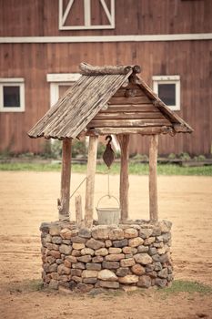 ancient wishing well of old western building
