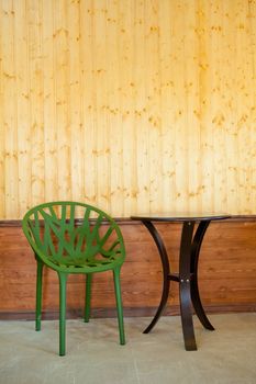 Classic interior with chair and wood wall