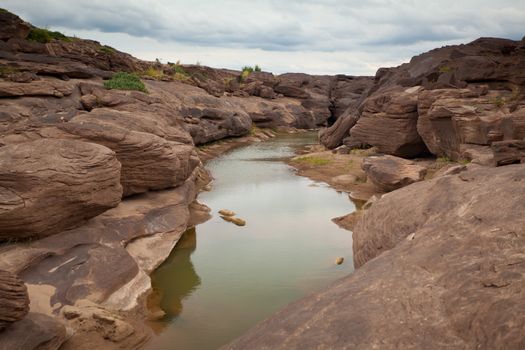 Sampanbok (3000 Hole), The Amazing of Rock in Mekong River, Ubon Ratchathani, Thailand.