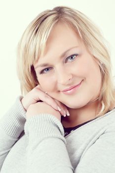 Portrait of cute smiling relaxing plump woman