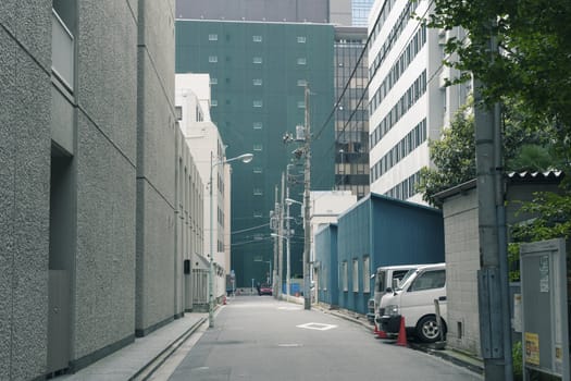 straight city driveway among huge buildings in Tokyo