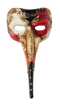 Upper view image of a colorful long nose Venetian mask against a white background.