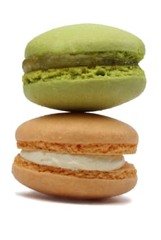 Macro image of two macarons against a white background.