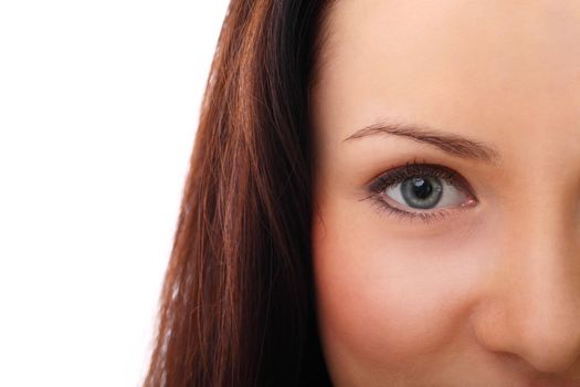 Beautiful brunette half shooted face close up over a white background