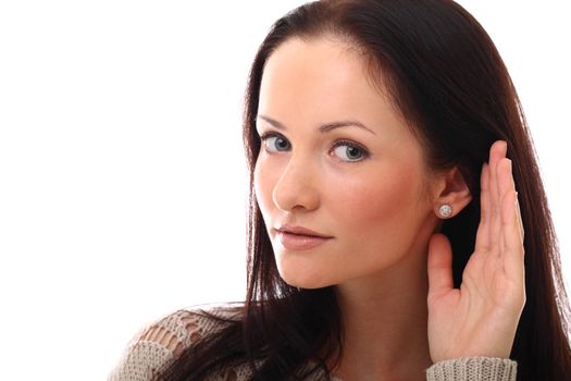 Portrait of beautiful young woman listening gesture