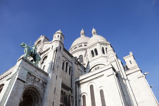 Basilica of the Sacre Coeur in Montmartre Paris under pure blue sky