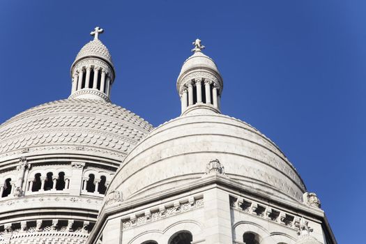 Basilica of the Sacre Coeur in Montmartre Paris under pure blue sky