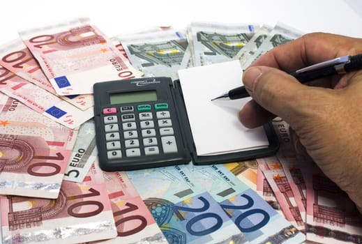human hand with euro paper and calculator