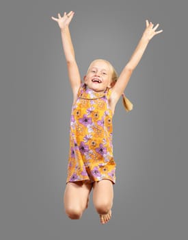 girl jumping hands up, happy and smiling