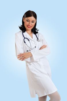 Portrait of happy successful young female doctor holding a stethoscope